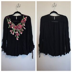 Elegant Black Blouse with Pink Floral Design.